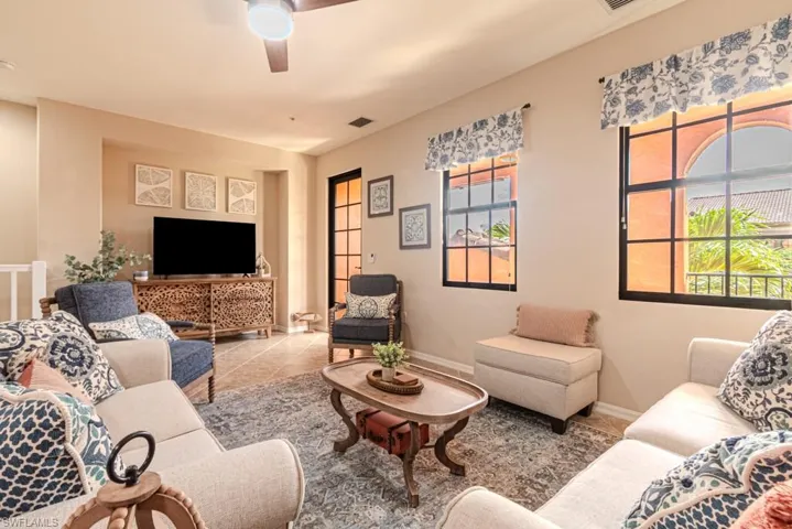 Tiled living room with ceiling fan