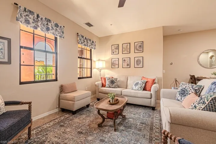 Living room with dark tile patterned flooring