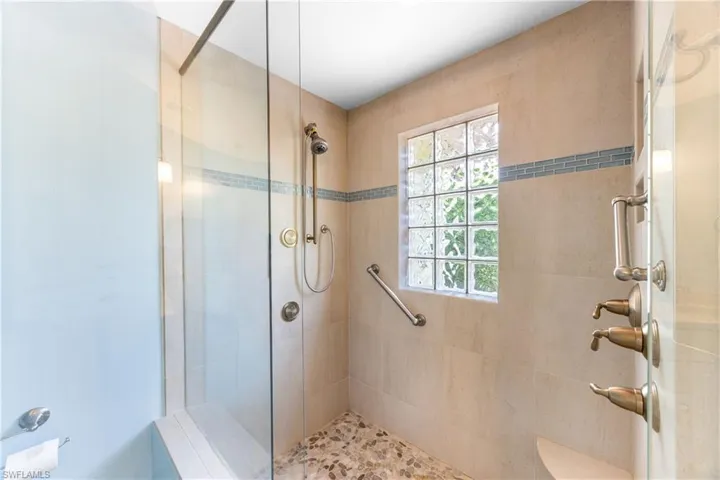Bathroom featuring tiled shower