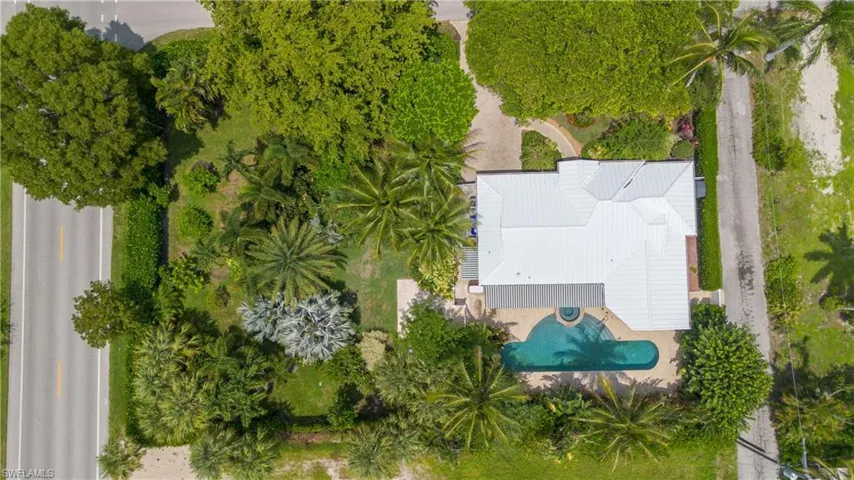 View of subject property featuring a pool area