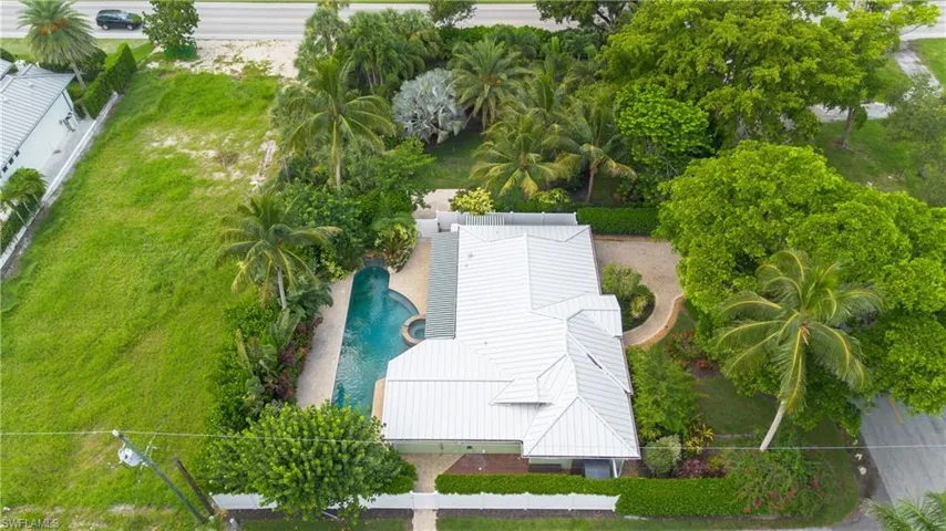 View of subject property with a pool