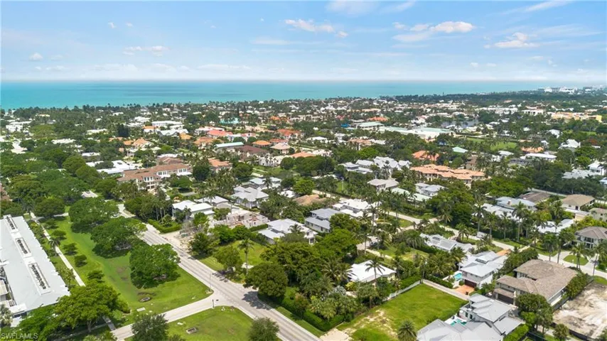 Aerial overview of property's location featuring a nearby body of water