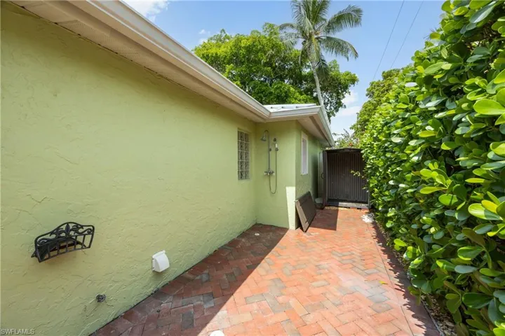 View of home's exterior featuring stucco siding and a patio area