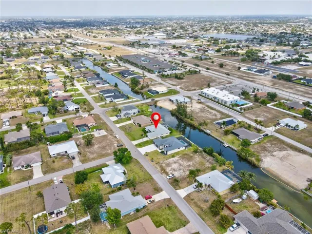 Bird's eye view featuring a water view and a residential view