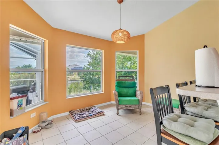 Living area featuring baseboards and light tile patterned floors