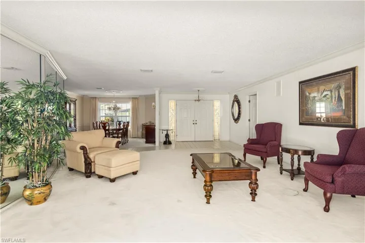 Formal Living Room with pool and lake view