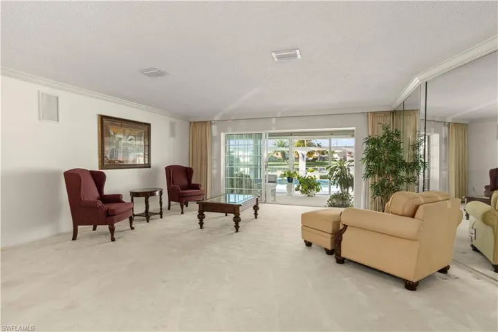 Formal Living Room with pool and lake view