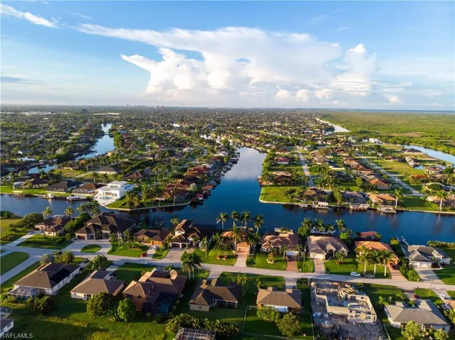 View of property location with nearby suburban area and a nearby body of water
