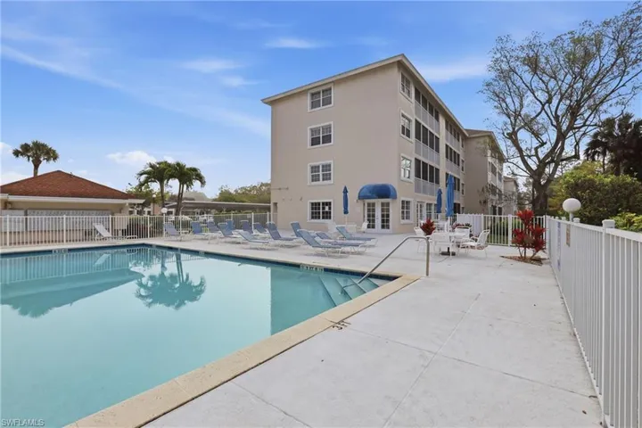 Community pool featuring a patio area and french doors