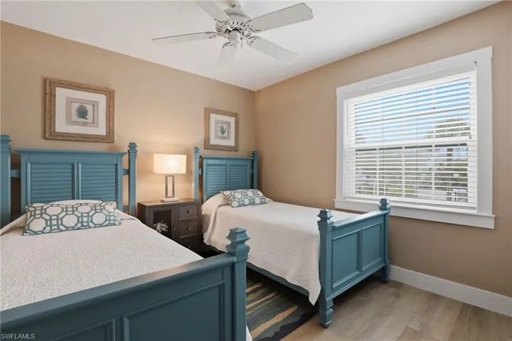 Bedroom featuring light wood-style flooring and a ceiling fan