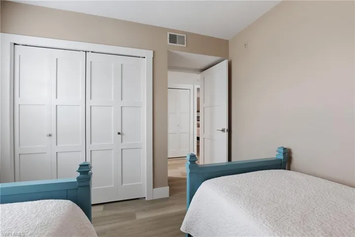 Bedroom featuring a closet and light wood finished floors