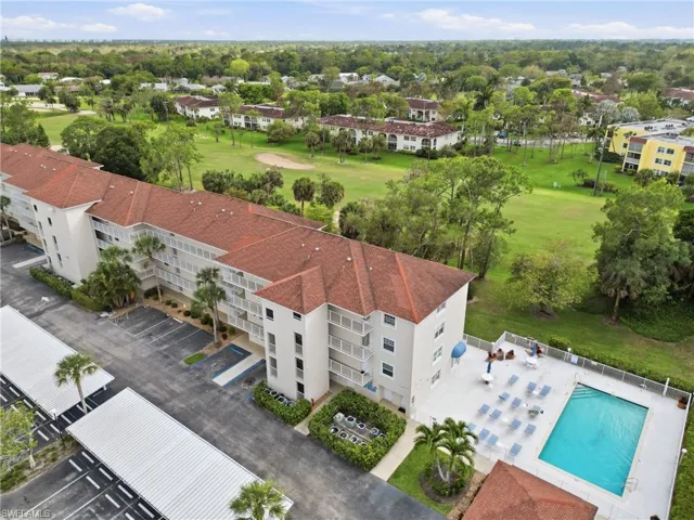 Bird's eye view of apartment complex and a local golf course