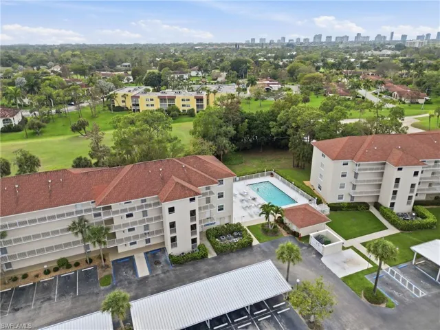 Aerial view of apartment complex and skyline