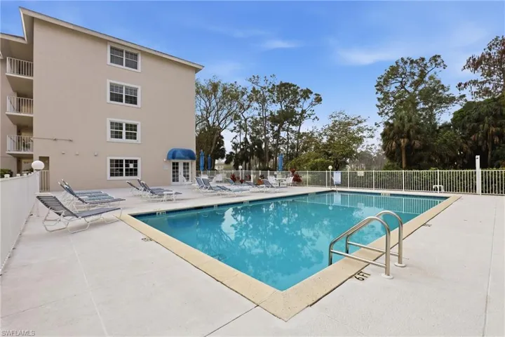 Community pool featuring a patio area