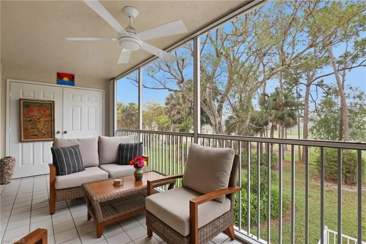 Sunroom / solarium with ceiling fan, a balcony, and outdoor lounge area