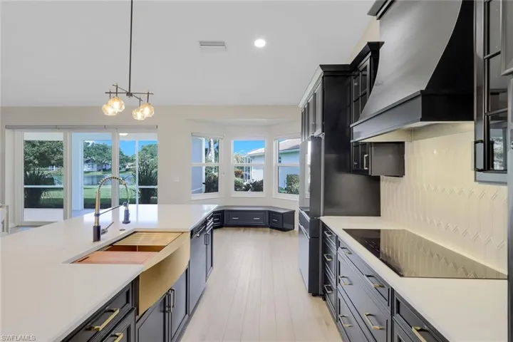 Modern, sleek black and golf kitchen