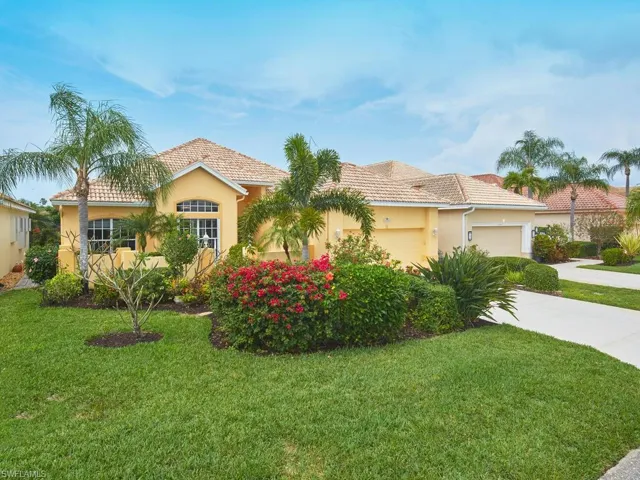 A true tropical paradise with lush & mature landscaping.
