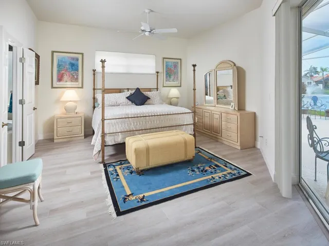 Large primary bedroom with access to the pool.