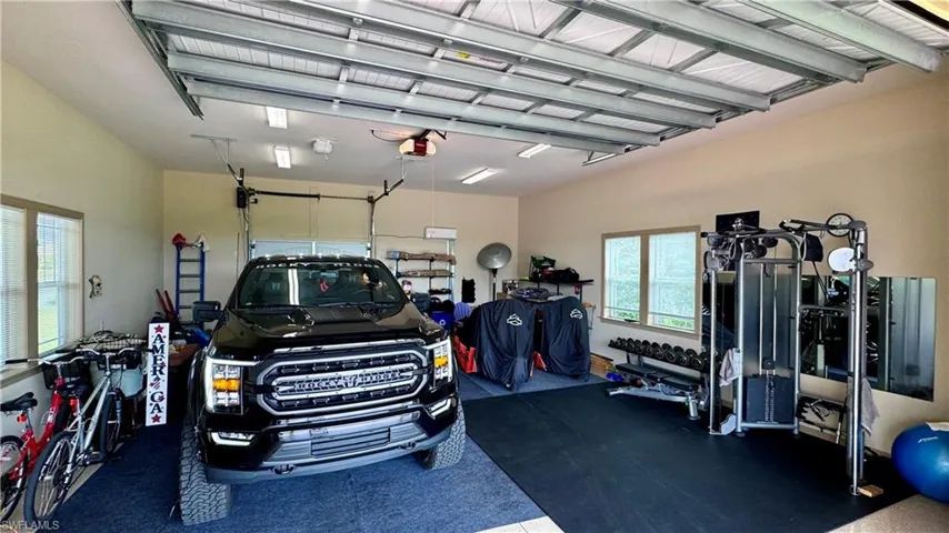 Garage featuring a garage door opener