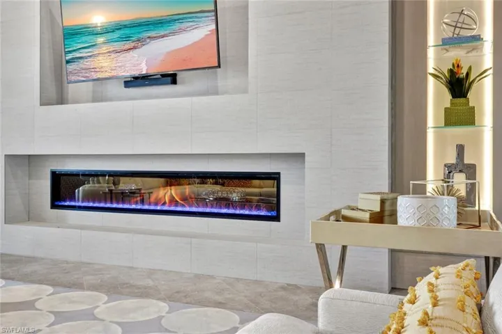 Beautiful custom Focal Wall in Great Room, all custom built with a fireplace for entertaining.