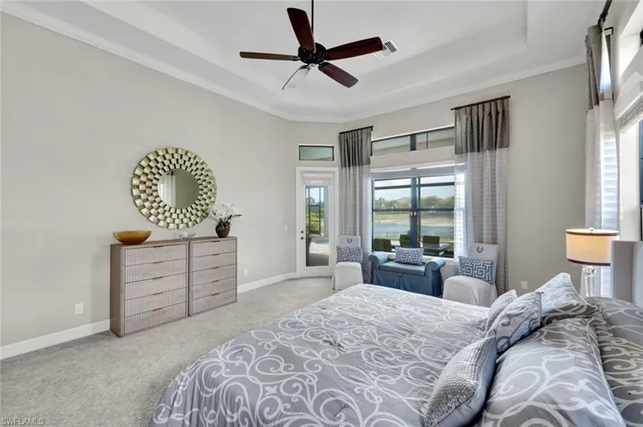 Spacious Primary Bedroom with custom window treatments
