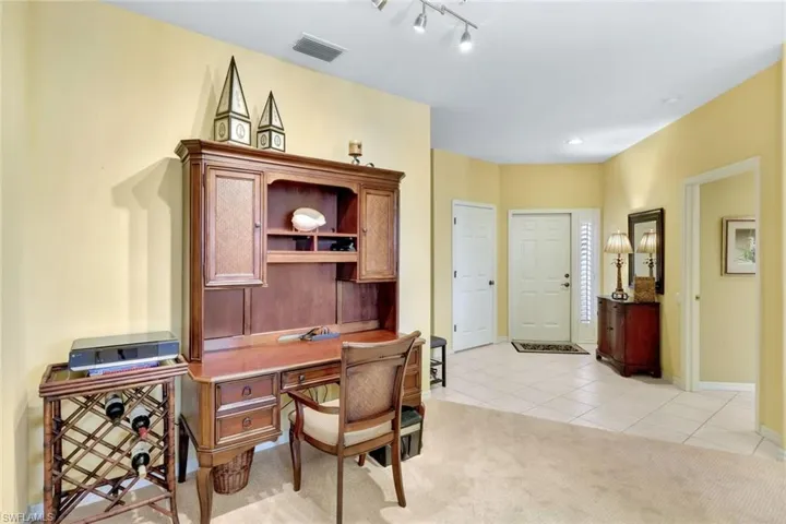 Office with light colored carpet