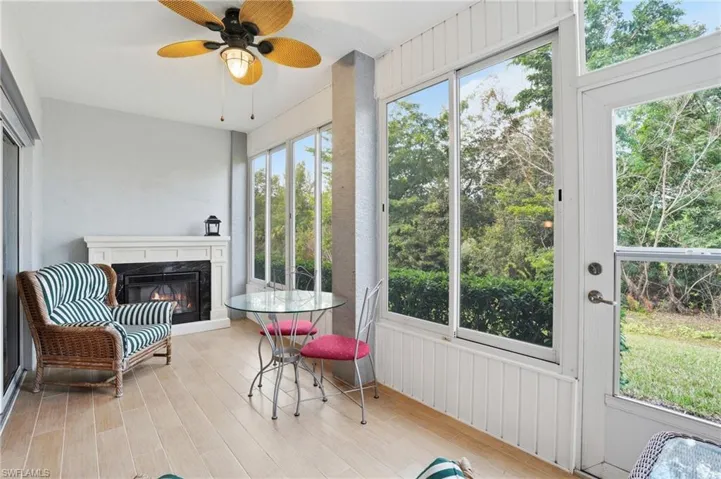 Sunroom with wood finished floors