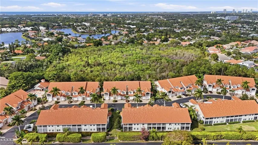 Aerial perspective of suburban area with a large body of water
