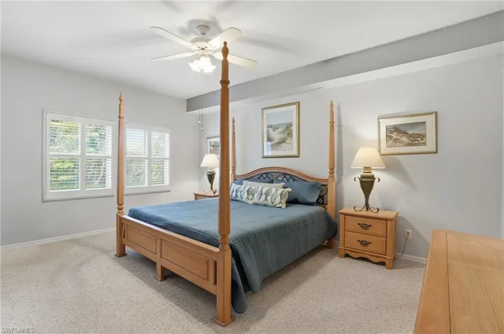 Bedroom featuring ceiling fan and light carpet