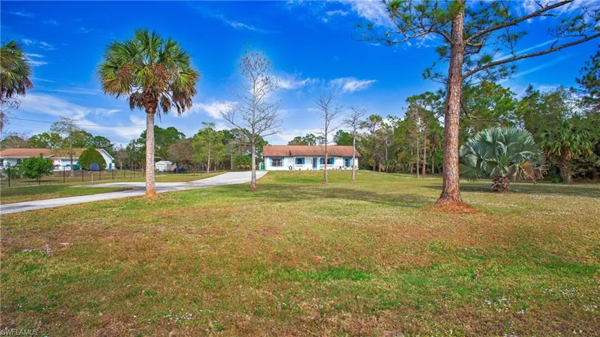 Front yard with paved driveway