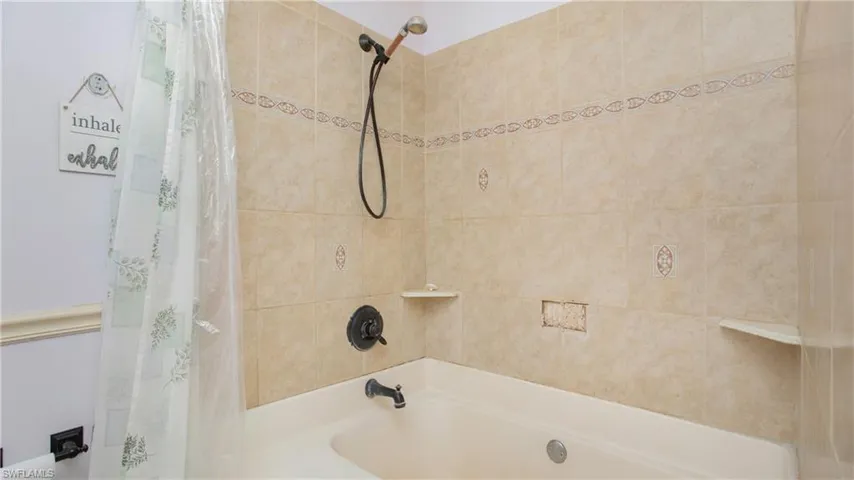 Master bathroom featuring shower/bath combination