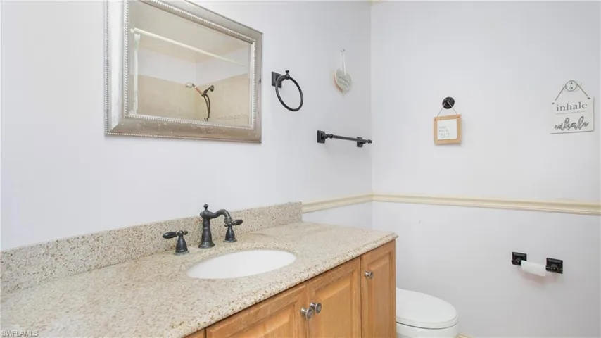 Master bathroom with vanity and toilet