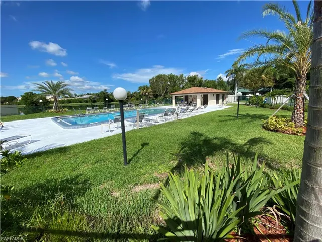 Community pool featuring a patio