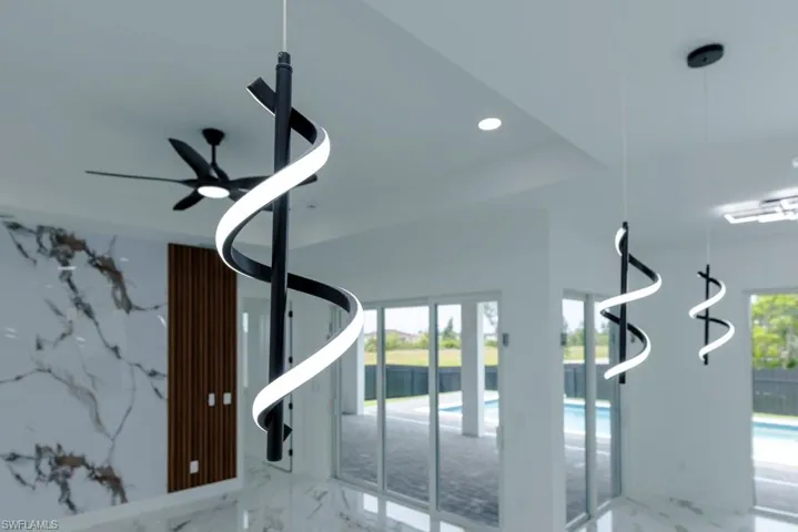 Detailed view of recessed lighting and a ceiling fan