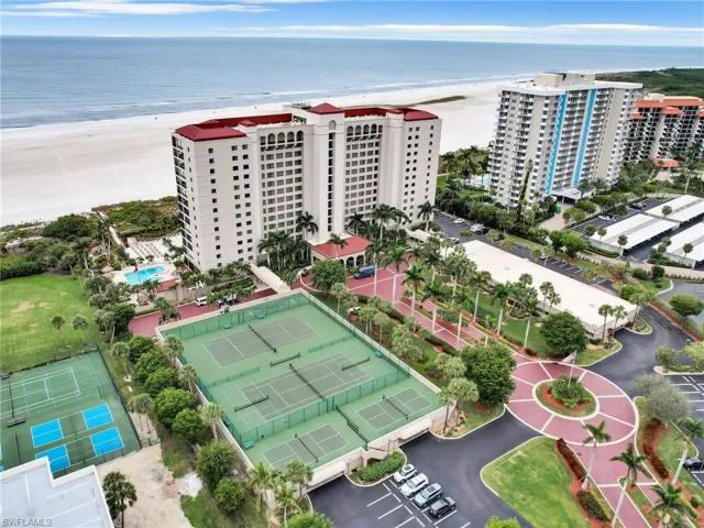 Drone / aerial view with a beach view and a water view
