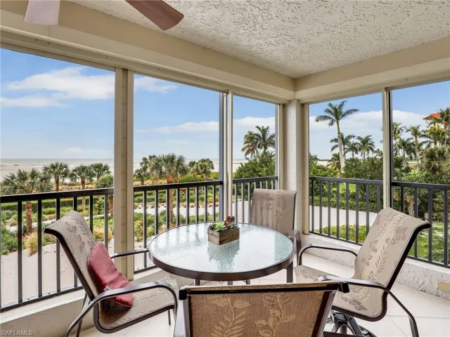 Sunroom with ceiling fan and a wealth of natural light