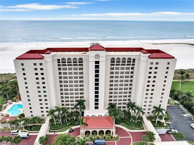 Bird's eye view with a view of the beach and a water view