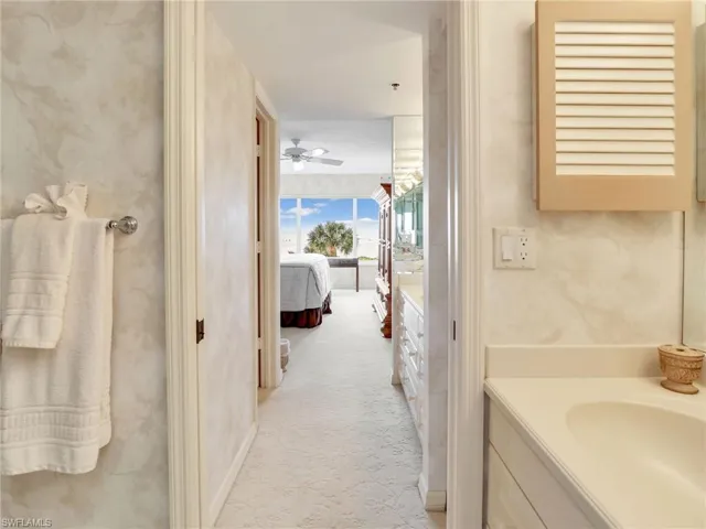 Bathroom with vanity and ceiling fan