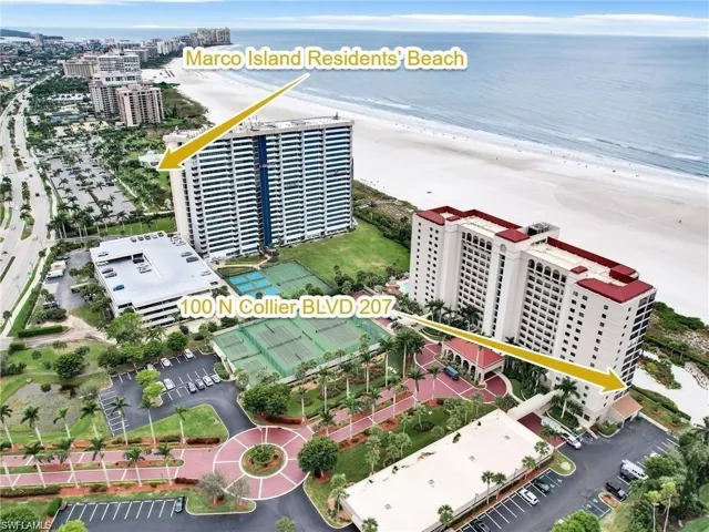 Aerial view featuring a view of the beach and a water view