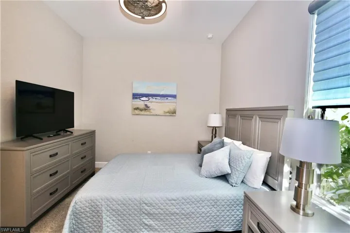 Bedroom with light carpet