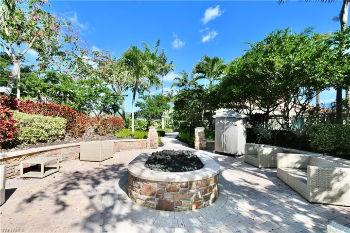 View of patio with an outdoor fire pit