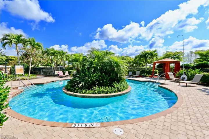 Community pool with a patio area
