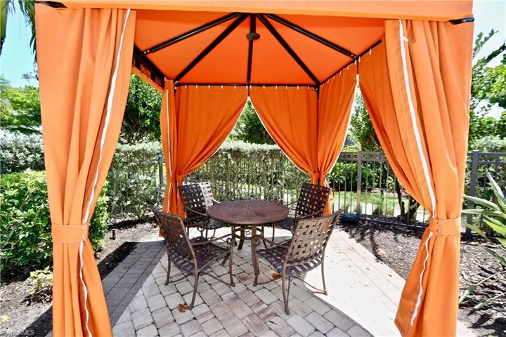 View of patio / terrace with outdoor dining space and a gazebo