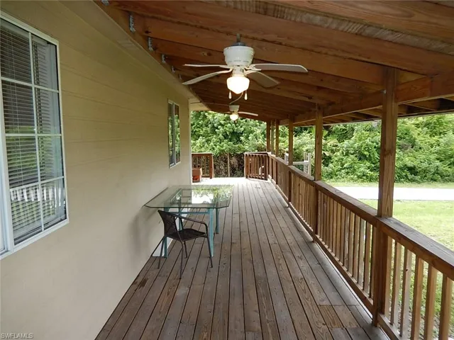 Wooden deck featuring ceiling fan