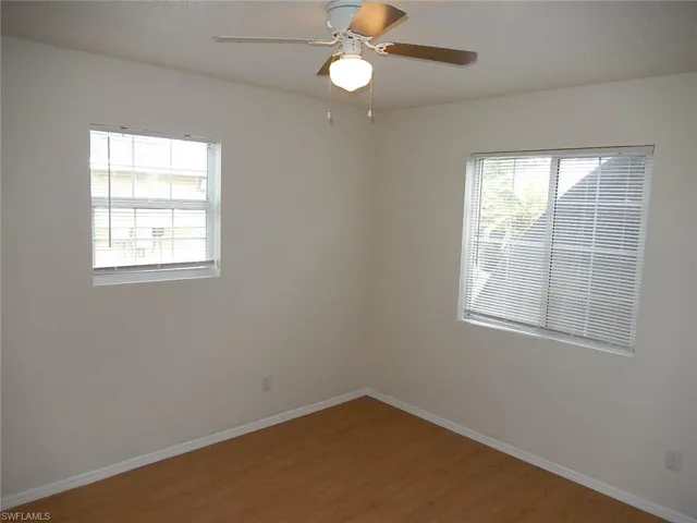 Spare room featuring light wood-style floors and a ceiling fan
