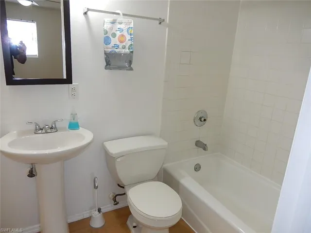 Full bath with toilet and shower / tub combination