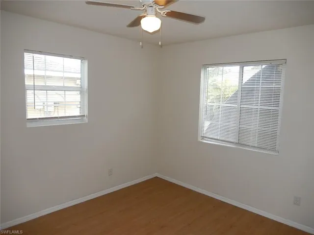 Spare room featuring light wood-type flooring and ceiling fan