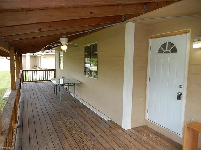 Wooden deck with a ceiling fan
