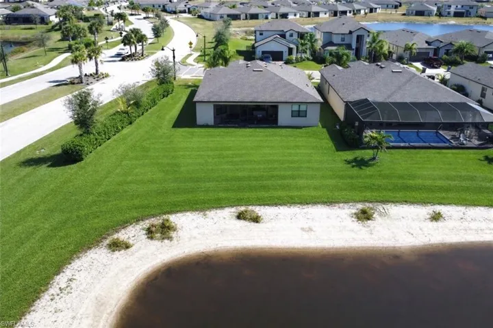 Aerial perspective of suburban area with a large body of water