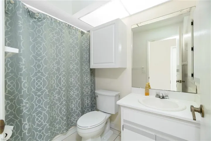 Full bath featuring vanity and toilet